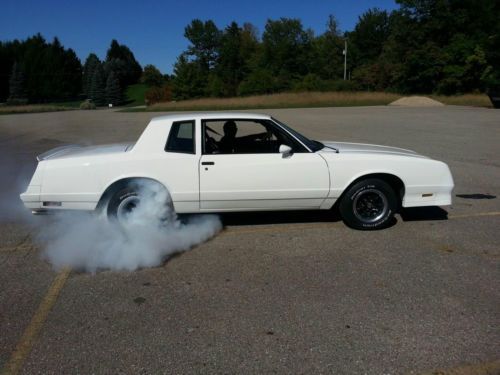 White 1985 monte carlo ss coupe. burgandy inter. 54k orig miles. great condition