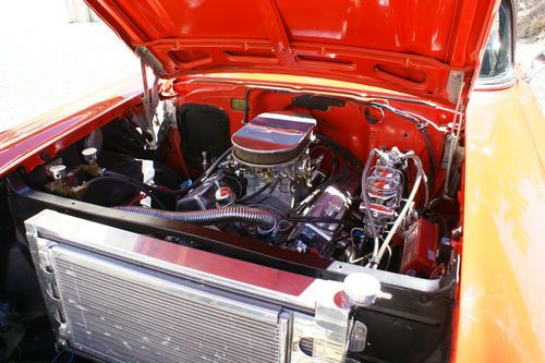 57" chevy 2 door bel air, matador red w/ black interior