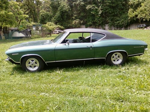 1969 chevy chevelle green metalic with black top