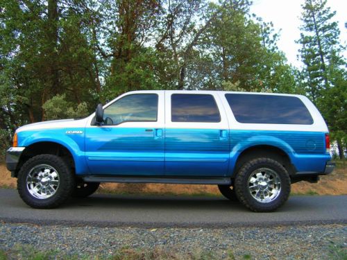 Custom candy blue paint lift 20&#034; wheels 35&#034; toyo mt&#039;s low miles super clean