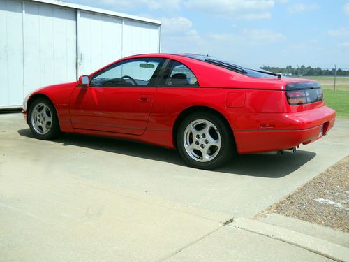Red with black leather interior..all in excellent condition..no rips, tears, etc