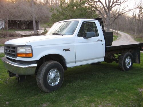 Good running good looking f250 flatbed 4x4 5.8 v8 low miles 82k boss plow ready
