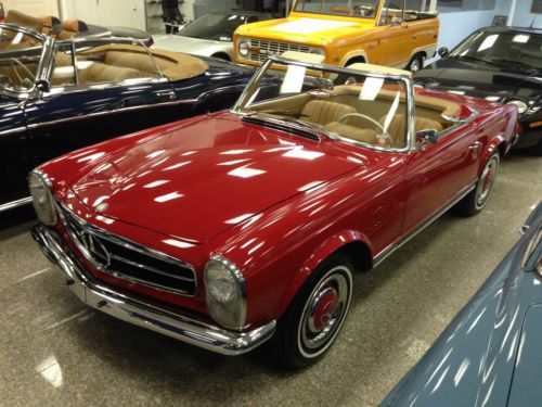 1966 mercedes 230sl convertible in excellent condition. restored, no rust