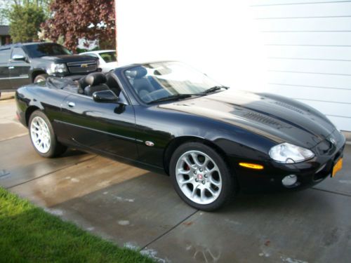 2002 jaguar xkr, black convertible 56000 miles . new tires, brakes,no winters