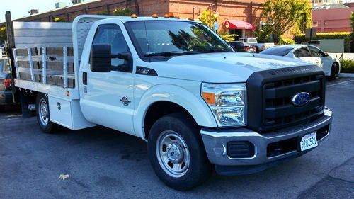2011 ford f-350 flatbet truck  - 7,400 miles - hydraulic lift - price reduced