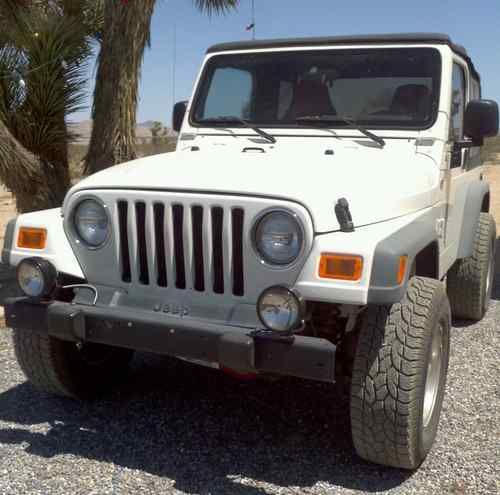 2005 white jeep wrangler, runs perfect, 94,500 miles.
