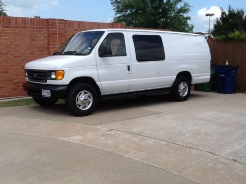 2005 ford e350 extended van with a 6.0 diesel engine and seats 4 people