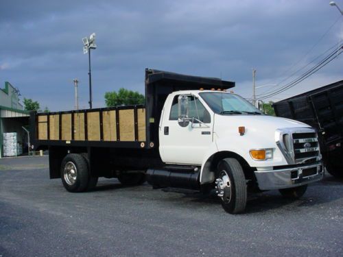 2004 ford f650 16&#039; flatbed dump truck 38k actual miles cat diesel 7speed trans.