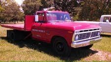Red, 1974 ford f350 with a 14' roll back bed,and very low original miles