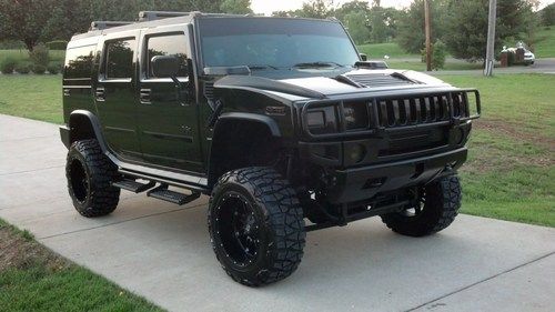 Lifted hummer h2 suv fairly new rims tires lift stereo system tv $10k in extras