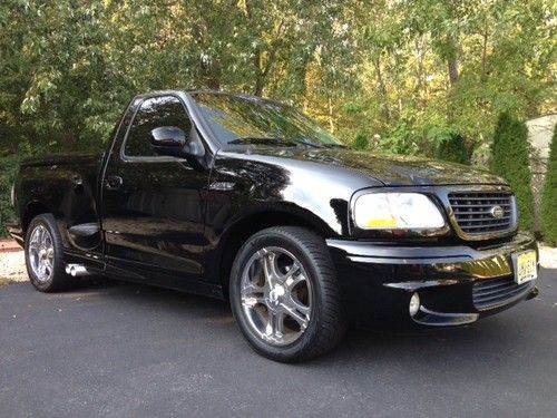 2001 ford lightning svt f-150 100% stock engine, custom rims and exhaust