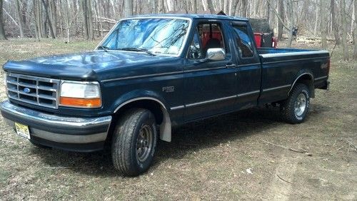 1995 ford forest green extended cab 4 wheel drive 8 ft. bed with bed liner