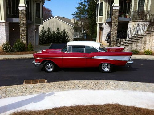1957 chevy bel air. red and white and completely restored to factory!
