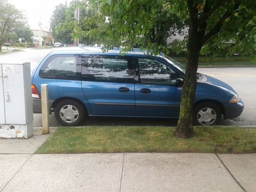 2003 ford windstar mini van 7 passenger or convert to  cargo only 65k miles !!