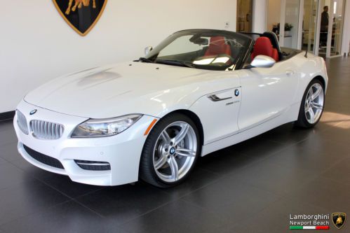 35 is roadster, mineral white metallic/red, paddle-shifters, like-new, 3,200 mls
