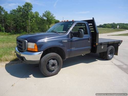 Solid f-550 flatbed 7.3l powerstroke 6 speed with 133,000 miles