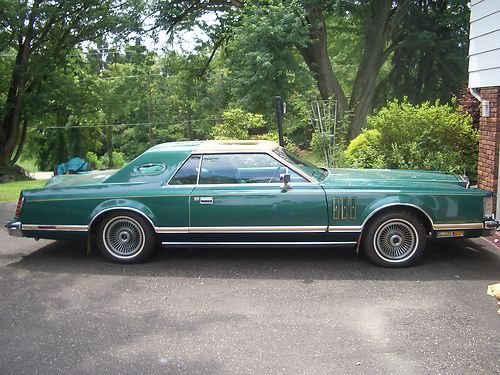 Lincoln is emerald green, emerald green velour interior, excellent cond.