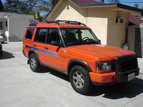 2004 orange land rover discovery g4 lmited edition