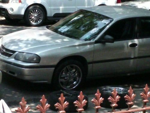 2002 chevy impala/ silver, 4 18" rims, one needs tire, and pioneer cd player.