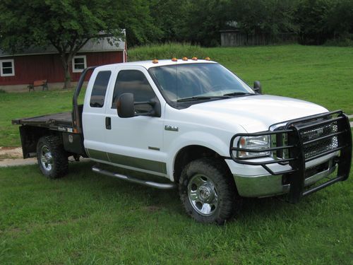 2005 ford f350 4wd flat bed truck with hydra bed hay bale handler