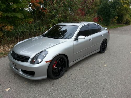 2003 silver infiniti g35 with custom exhaust bodykit and 19x8 nismo rims