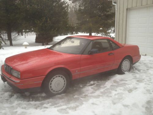 Red,with black leather interior, two tops, 56,000 miles very clean