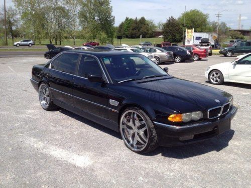 This is a bmw 7-series with alot of extras (questions) feel free