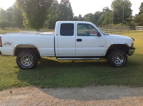 White, good condition, some wear, 199,000 miles, 4wd, extended cab