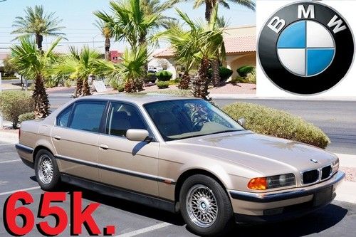 1995 bmw 740il with only 65k. actual miles. nice and clean runs great no reserve
