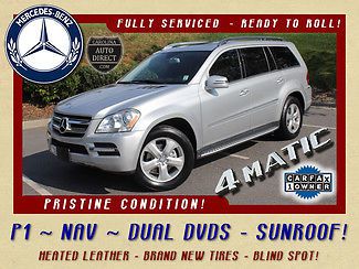 Dual dvds-navigation-blind spot assist-heated leather-pano sunroofs-new tires!