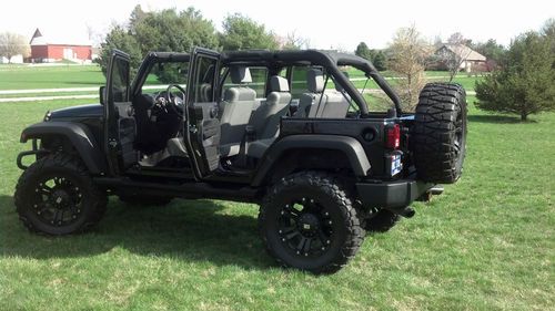 Custom black 2007 jeep wrangler, lifted, 4 door, 37 in. wheels, clean, nav,etc