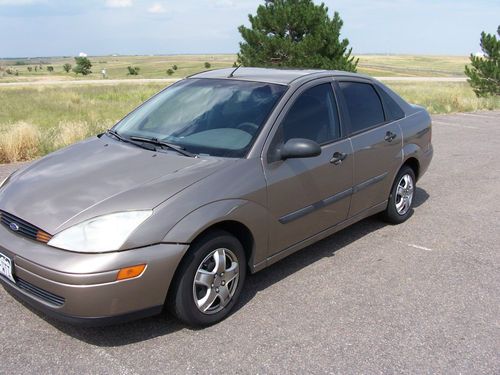 2003 ford focus 4 door, 2 liter, 4 cylinder automatic, runs and rides good