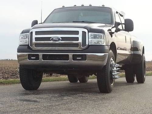 Black 2001 ford f350 7.3 powerstroke 6 speed dually on 22.5 semi wheels