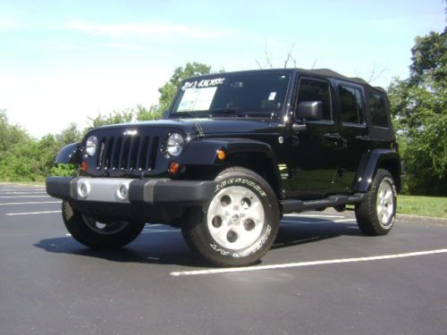 Like new 2013 jeep wrangler unlimited 4x4 sahara black on black only 7k miles