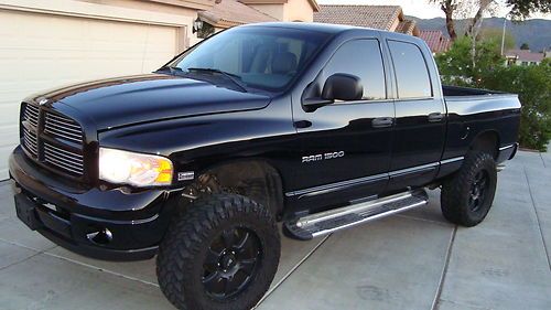 Lifted up and blacked out!!! crew cab 4x4 that turns heads!!