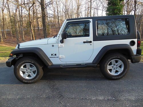 2007 jeep wrangler, white w/black top, great condition, 2d, 4wd, kept garaged
