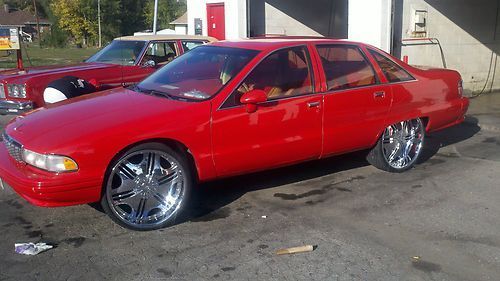 Fully loaded cherry red chevy clean inside out call mike 4028123916