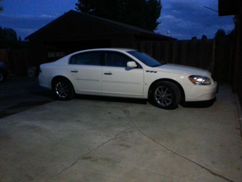 Almost new, 48 k miles, white premium package buick lucerne, beautiful wood exlt