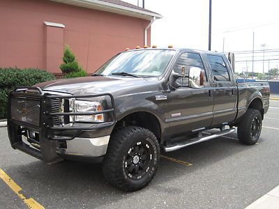 2006 ford f-350 lariat crew cab fx4 turbo diesel only 104k, lift, rims, must see