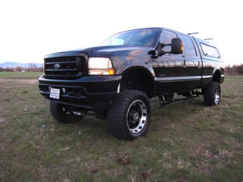 Big black lifted f350 crew cab 4x4 power srtoke banks must see no reserve