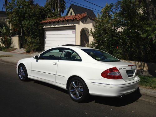 White, great condition, hugs the road, fast, grey interior, two door,nav,sunroof