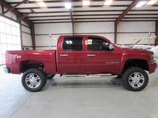 Red crew cab 6in lift chrome 20s new tires low miles financing cloth extras nice