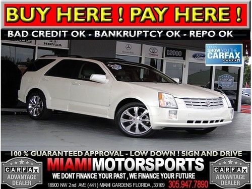 We finance '06 suv panoramic sunroof leather entertainment system on headrest ..