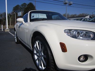 Very low miles! convertible one owner smoke free cd touring package! we finance!