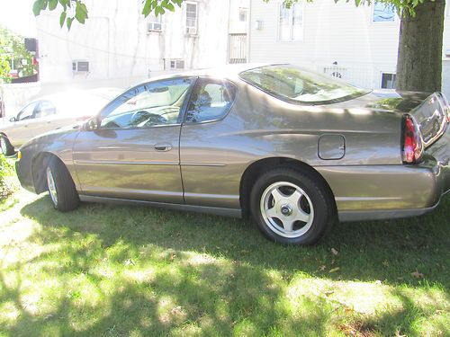 2003 chevy monte carlo 2dr. gold w/ beige 48,000.00 orig. miles