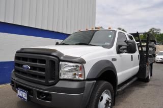 07 f450 crew cab xl 4x4, 6.0l powerstroke diesel,auto,flat bed w/stake sides