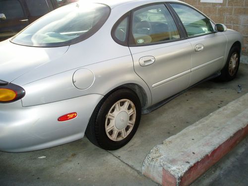 Ford taurus - well kept : super working ac / delivery available .... low price !