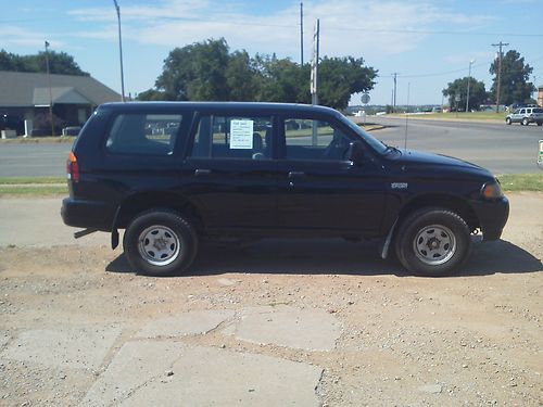 Montero sport, 4 door, black, looks good, drives great.