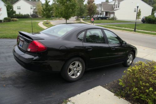 2001 ford taurus sel black with rear spoiler and alloy wheels