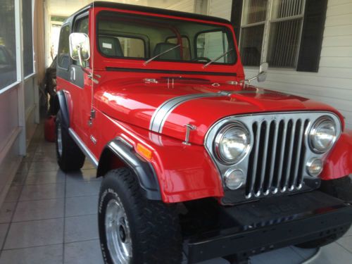 1980 cj7  jeep laredo; nice red body 3 speed trans.